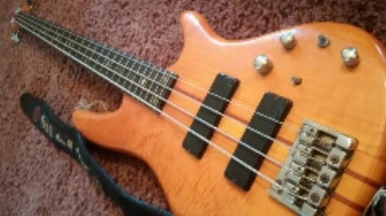 a bass, which may have dead strings.
